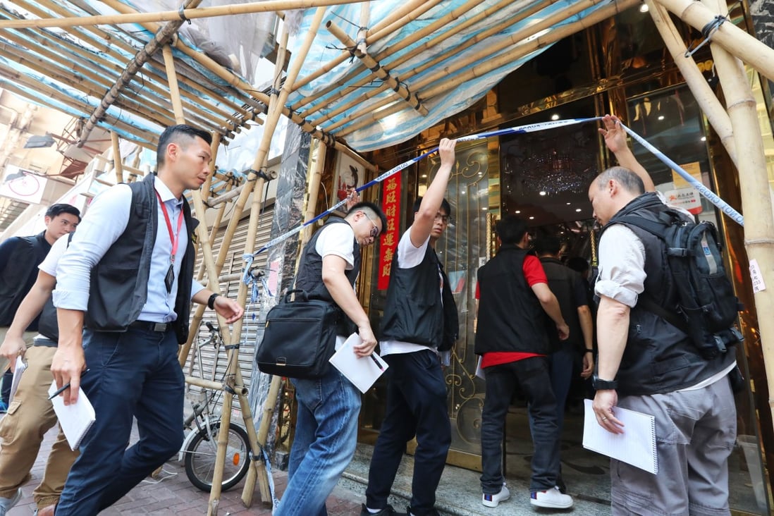 Police investigating the restaurant under renovation on the first floor of the Honour Building on To Kwa Wan Road, where the body of a woman was found. Photo: Felix Wong