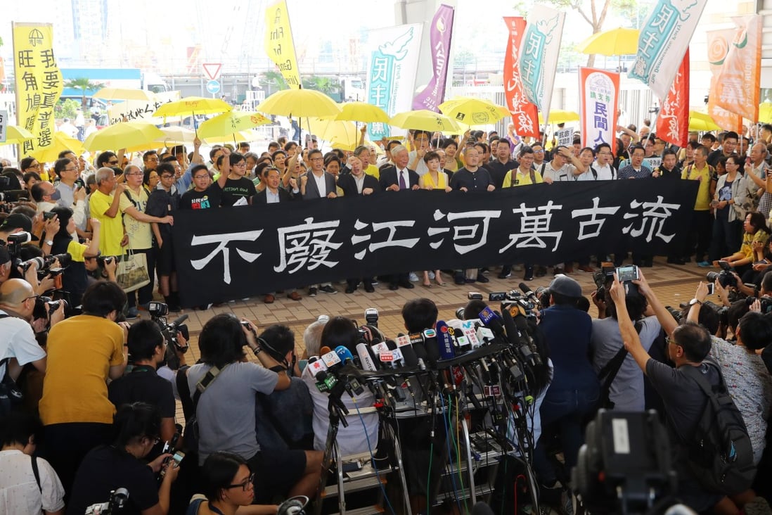 The nine Occupy leaders outside West Kowloon Court on Wednesday. Photo: Edmond So