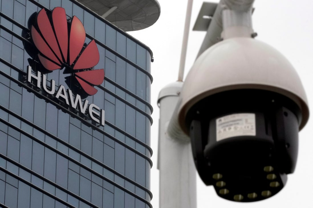 A surveillance camera is seen in front of the Huawei logo outside its factory campus in Dongguan, China, in March. Photo: Reuters
