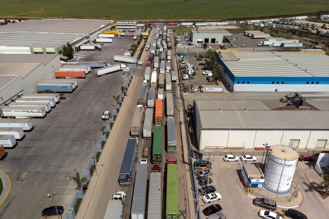 Aerial view of cargo trucks lining up to cross to the United States near the US-Mexico border (top) at Otay Mesa crossing port in Tijuana, Baja California state, Mexico, on April 2, 2019. Photo: Agence France-Presse