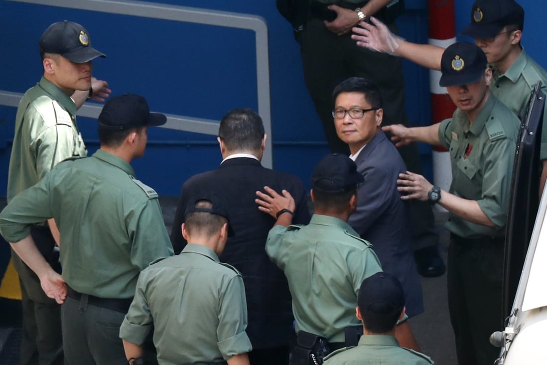 Occupy leaders, Benny Tai (left) and Chan Kin-man (right) arrive at the Lai Chi Kok Reception Centre, where they spent their first night behind bars. Photo: Robert Ng