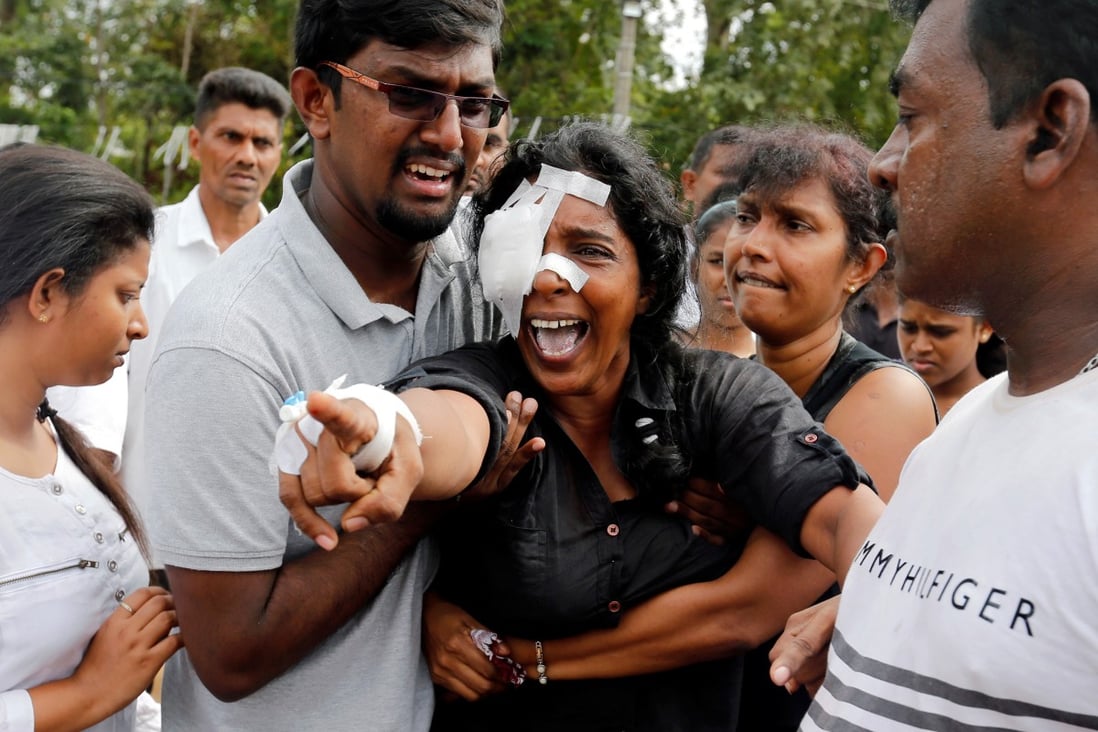 Kumari Fernando, who lost her husband and two children, during a mass burial for victims. Photo: Reuters