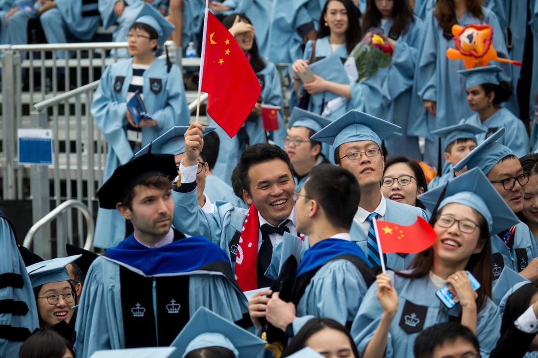 Graduates wave China flags during the commencement ceremony of the 264th Academic Year of Columbia University in New York. Photo: Xinhua