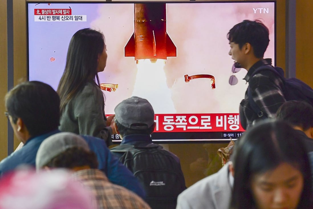 People in Seoul watch a report on North Korea on Thursday after the country fired two unidentified projectiles. Photo: Kyodo