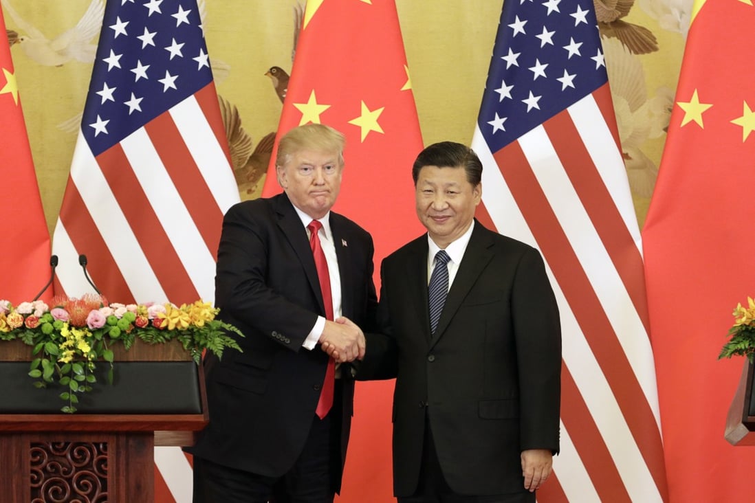 Donald Trump and Xi Jinping shake hands during a news conference at the Great Hall of the People in Beijing on November 9, 2017. Photo: Bloomberg
