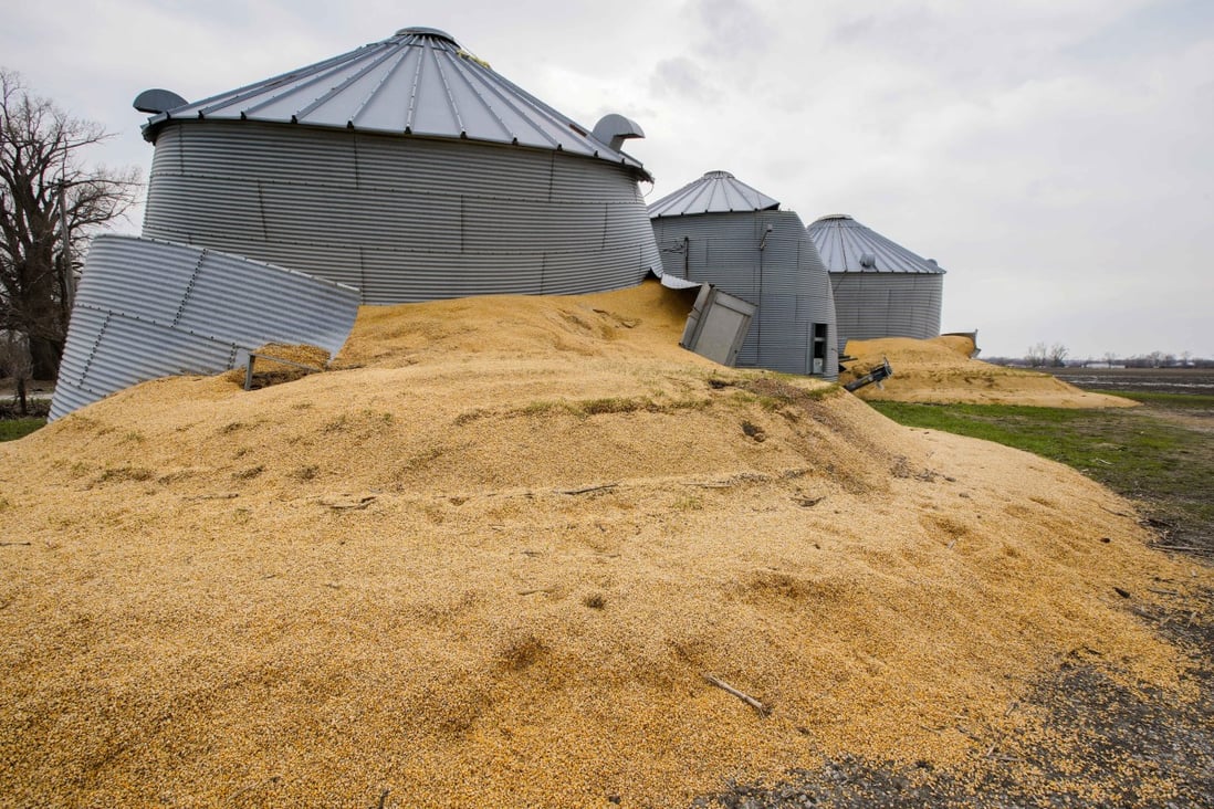 Flooding in April caused corn to burst out of silos on a farm in Bellevue, Nebraska. US farmers are also facing challenges from the trade war with China. Photo: AP