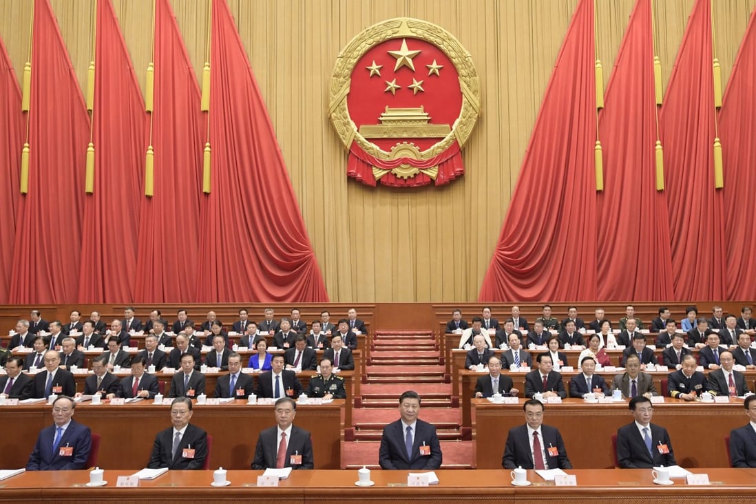 China’s President Xi Jinping (C, front), Li Keqiang (3rd R, front), Wang Yang (3rd L, front), Wang Huning (2nd R, front), Zhao Leji (2nd L, front), Han Zheng (1st R, front) and Wang Qishan (1st L, front) attend the opening meeting of the second session of the 13th National People's Congress at the Great Hall of the People in Beijing, capital of China, March 5, 2019. Photo: Xinhua
