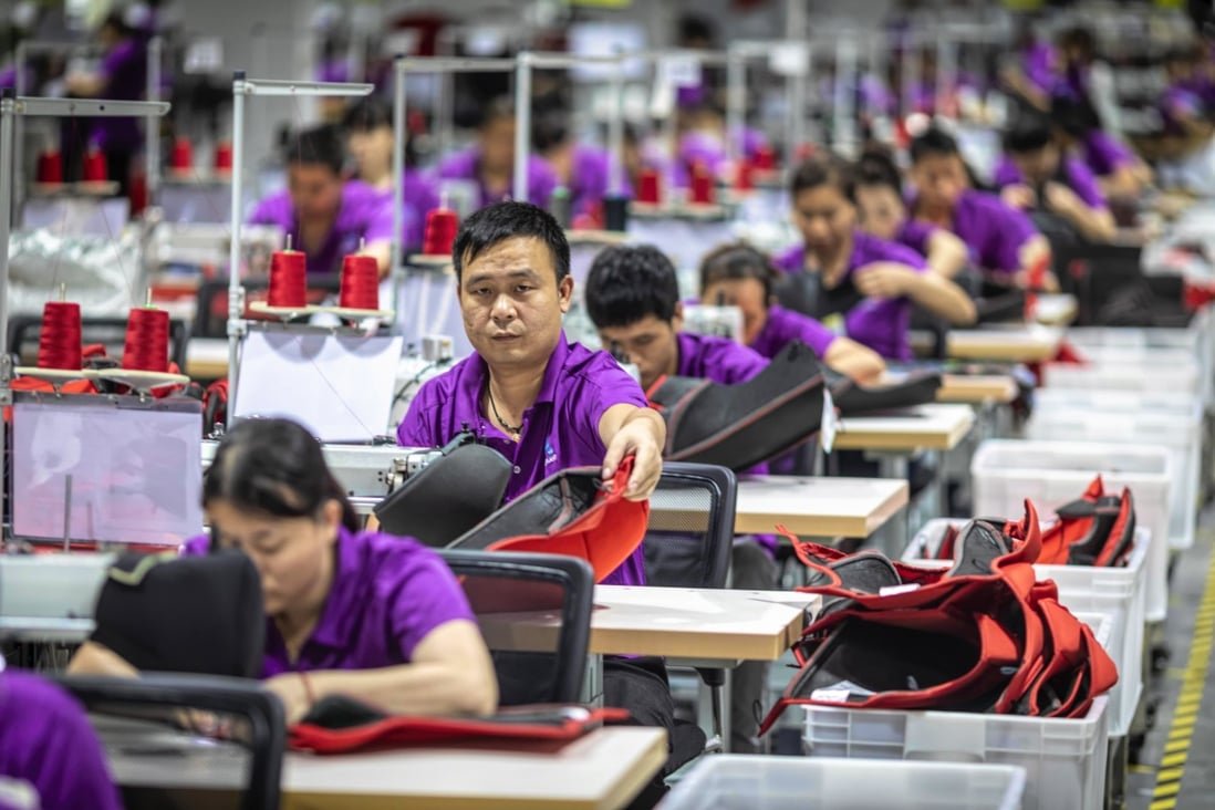 People work in Wonderland nursery products company in Dongguan, Guangdong Province, China. Nursery products are excluded from US-China trade war tariffs, but many other Guangdong-based manufacturers are being forced to move to Vietnam. Photo: EPA-EFE