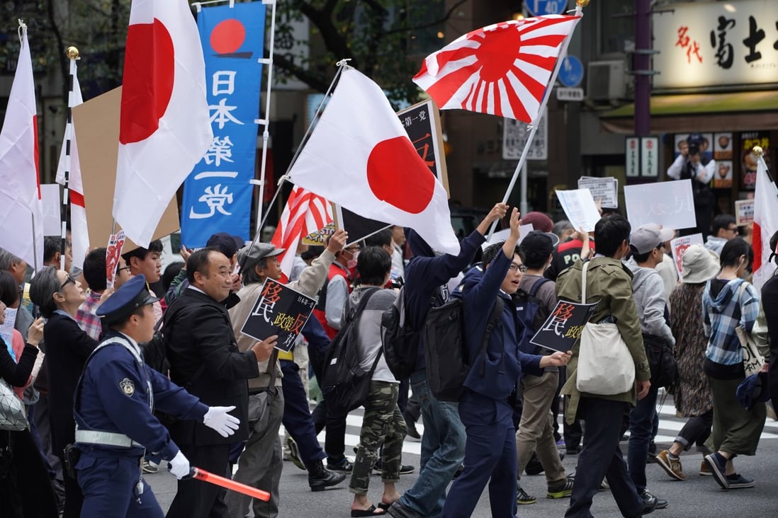 People protest in Tokyo against Japanese PM Shinzo Abe’s legislation clearing the way for more foreign workers. Photo: Bloomberg