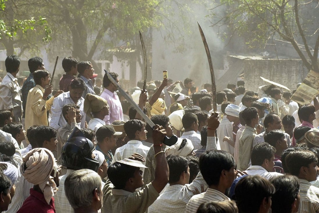 A Hindu mob faces off with a Muslim mob during during Gujarat’s 2002 riots. Photo: AFP