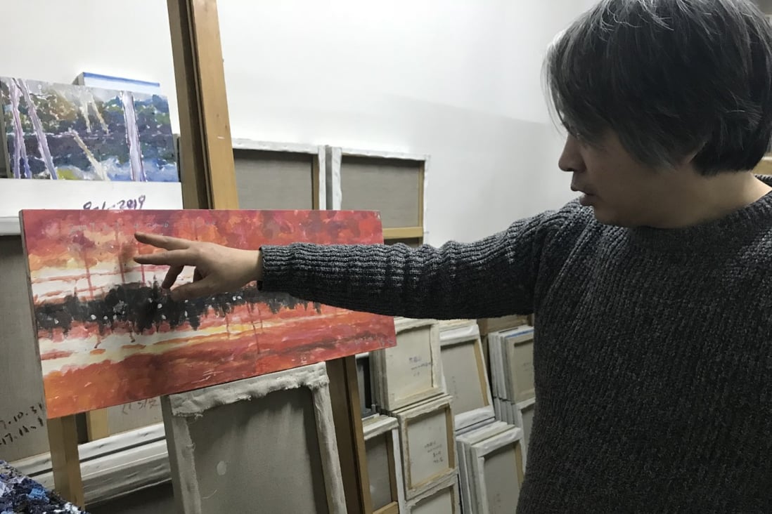 Artist Chen Guang reflects on the painting Blood Red Anxiety at his studio in Beijing. Photo: Mimi Lau