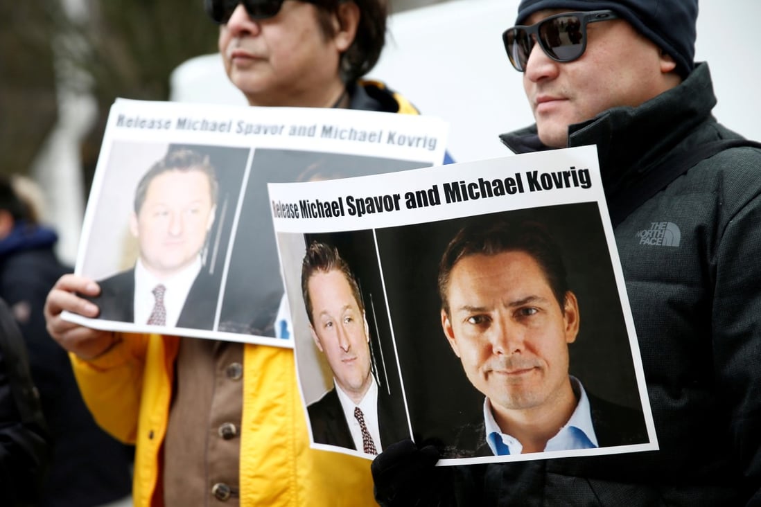 Protesters hold signs calling for China to release Canadian detainees Michael Spavor and Michael Kovrig during an extradition hearing for Huawei executive Meng Wanzhou in Vancouver in March. Photo: Reuters