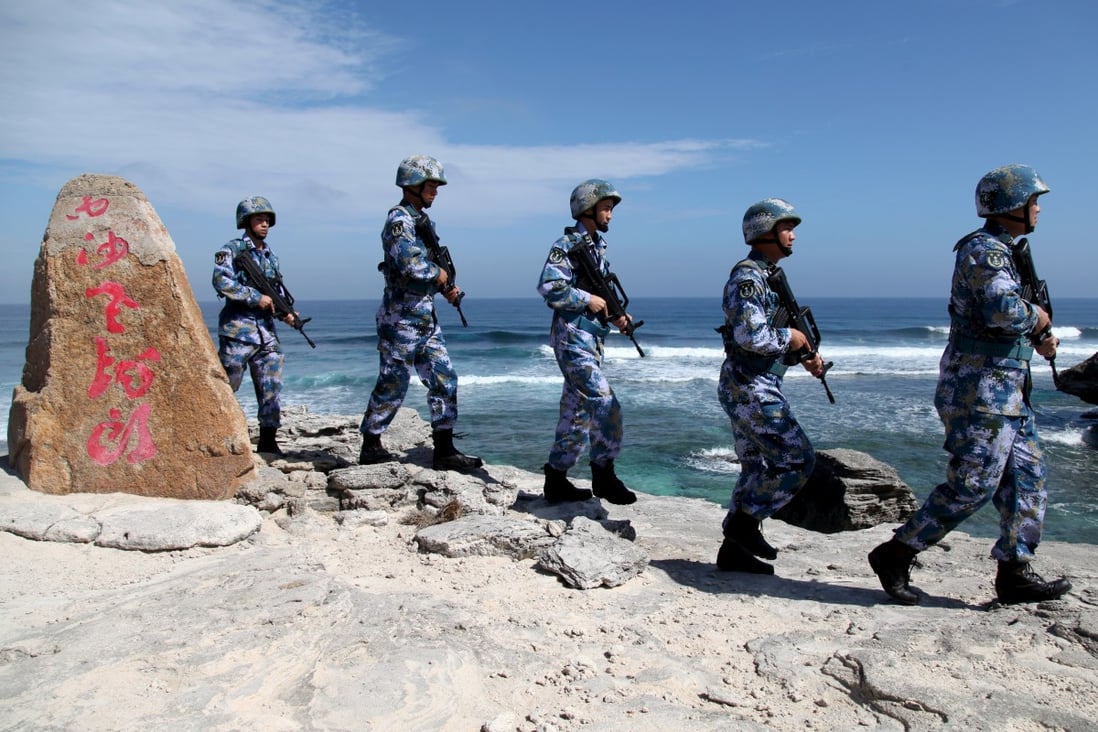 Chinese soldiers patrol Woody Island in the Paracels, one of many disputed isles in the South China Sea. Photo: Reuters