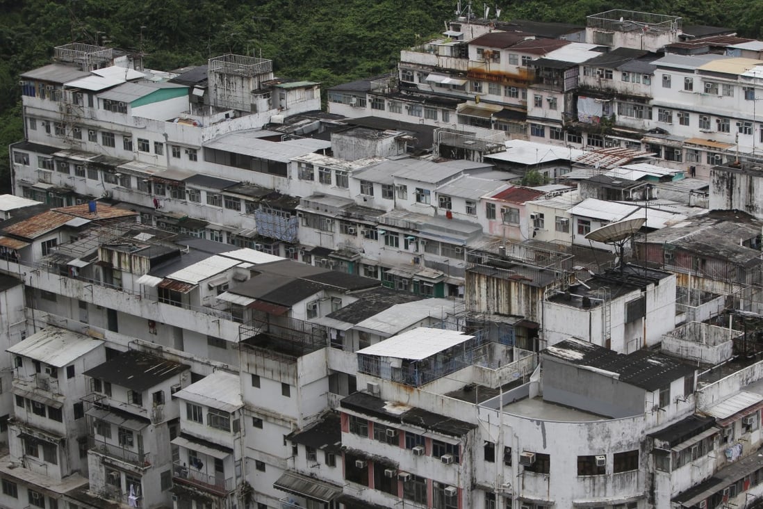 Illegal structures constructed on top of buildings on King’s Road, Quarry Bay. Unauthorised additions or alterations to buildings may affect the safety of a property and may render the title defective. Photo: SCMP