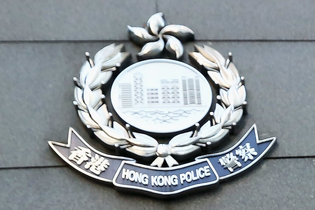Hong Kong Police officers on Tuesday raided the offices of the company accused of running a gold scam. Photo: Nora Tam