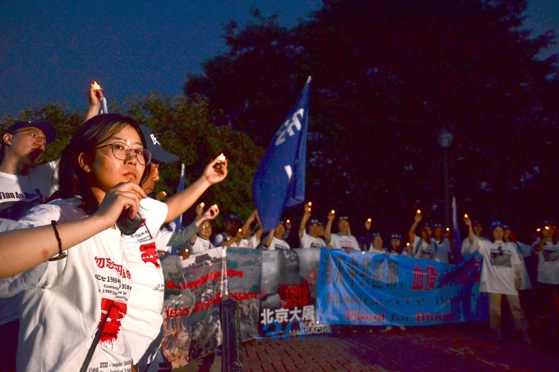 Outside the Chinese embassy in Washington, more than 100 people gathered to commemorate the Tiananmen Square crackdown of June 4, 1989. Photo: Nectar Gan