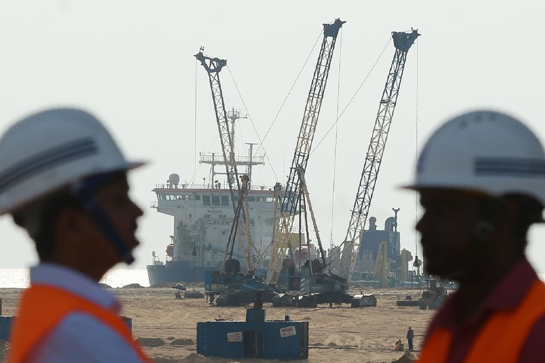 Pumps dredge sand near to Colombo’s main seaport. China, India and Japan are all helping Sri Lanka to develop the port. Photo: AFP