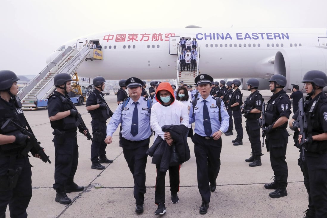 Beijing said the fraud suspects were rounded up following raids by Spanish and Chinese police in 2016. Photo: Xinhua