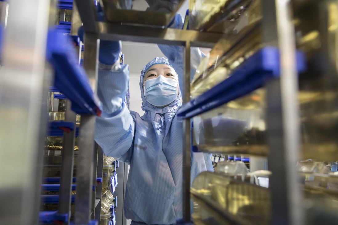 A technician loads containers on a rack at a Cyagen Biosciences facility in Jiangsu province, China, in March. Photo: Bloomberg