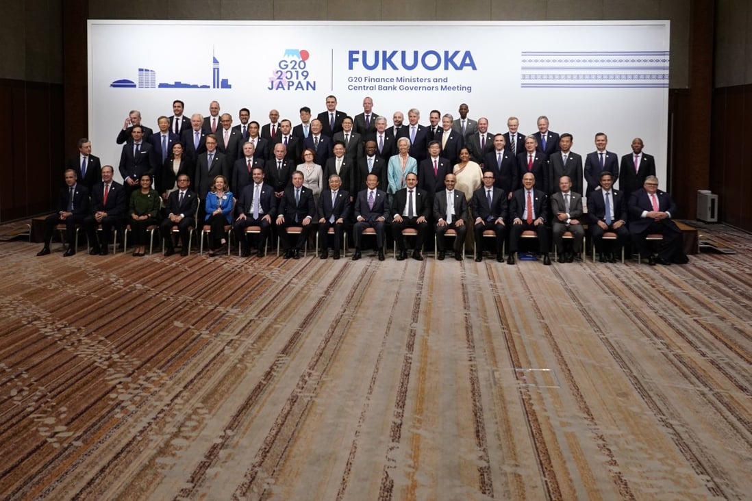 Financial policymakers from the world’s top 20 economies pose for a group photo in Fukuoka, Japan on Sunday. Photo: EPA