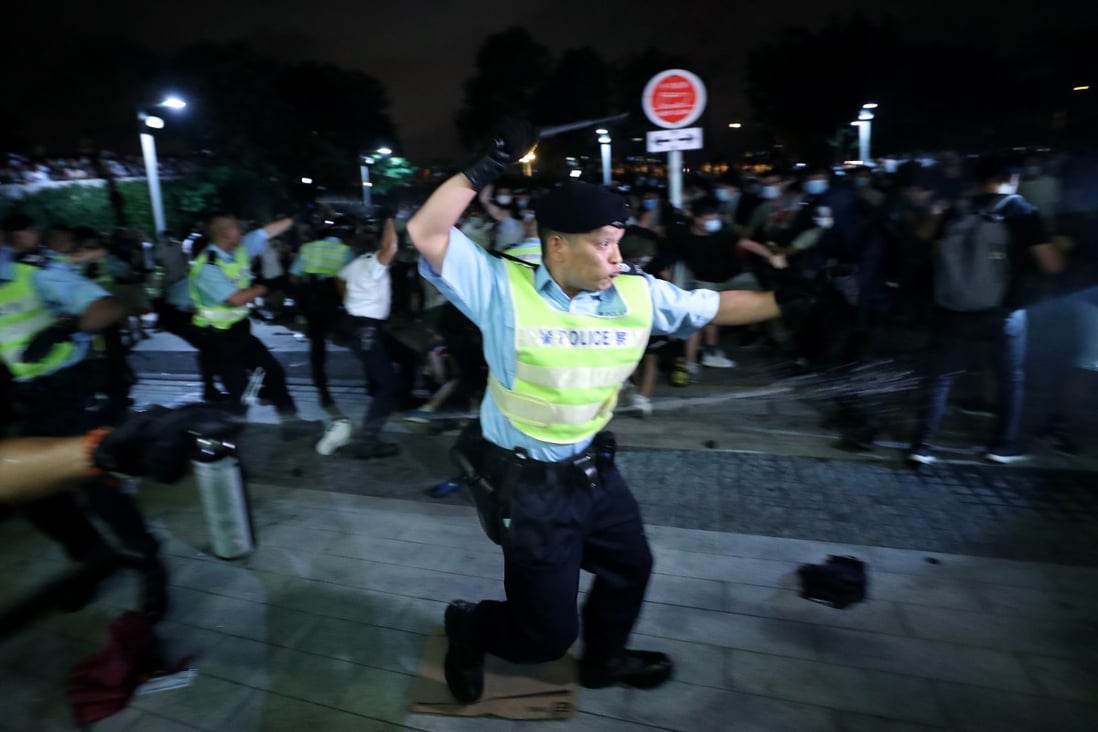 Hong Kong police use batons and pepper spray on protesters at the Legislative Council Complex in Admiralty, shortly after midnight on June 10. The day before saw over a million people, according to organisers, or at least 240,000, according to police, take to the streets in protest against a fugitive transfers bill that could see accused taken to mainland China for trial. Photo: Sam Tsang