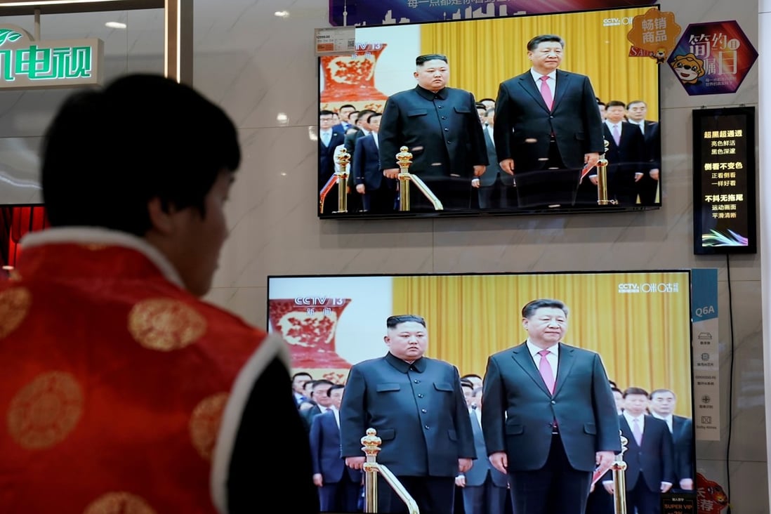 Television screens at an electronics store in Beijing show footage of North Korean leader Kim Jong-un’s meeting with Chinese President Xi Jinping in January. Photo: Reuters