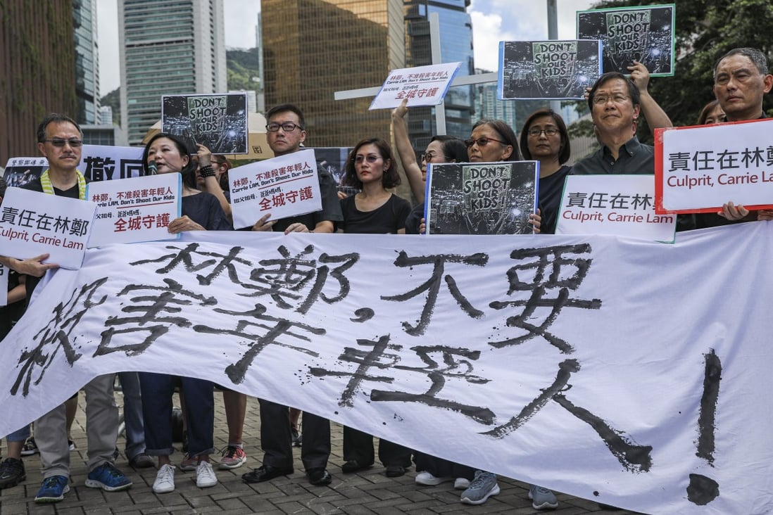 Protest groups, including teachers, parents, religious officials and two lawmakers gather outside the Chief Executive’s Office on Thursday. Photo: Sam Tsang