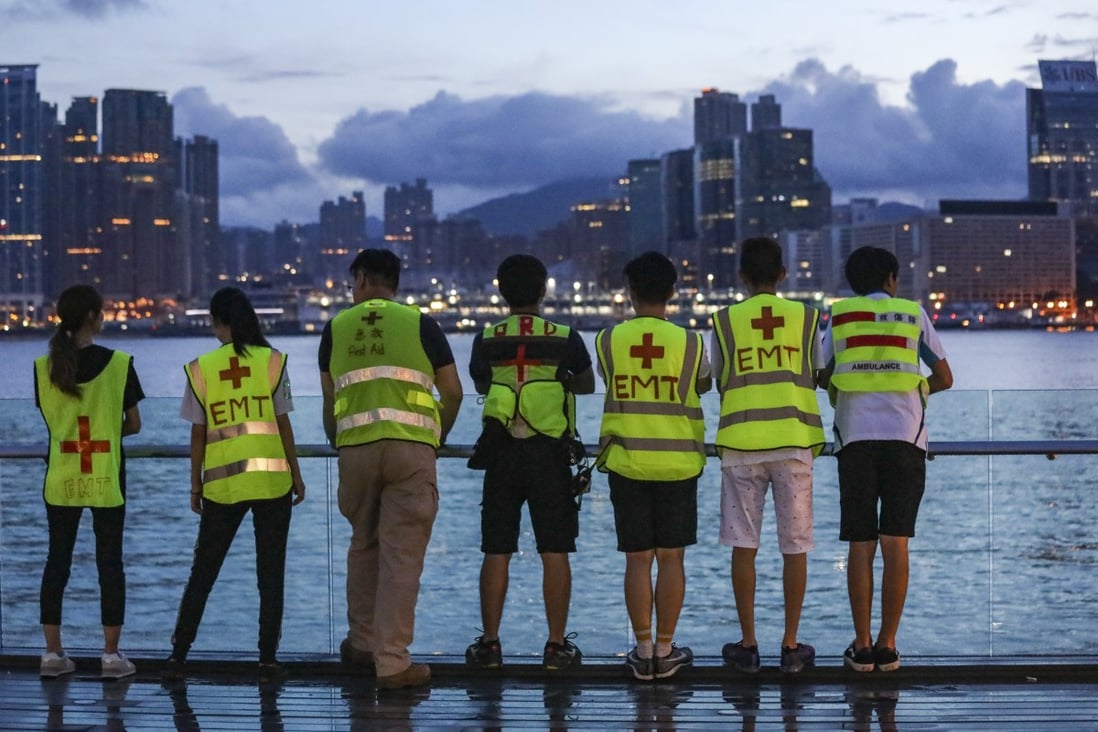 Protesters against the extradition bill take a breather at the harbourfront overlooking the Kowloon skyline outside government headquarters in Tamar, Admiralty, on June 18. The rising cost of housing in Hong Kong has fuelled public dissatisfaction. Photo: Dickson Lee