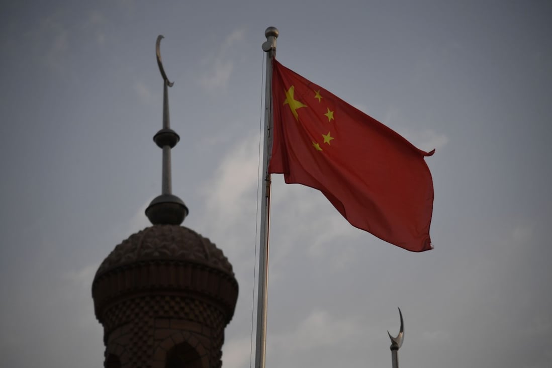 The Chinese flag flies over a mosque in Kashgar, Xinjiang. Photo: AFP