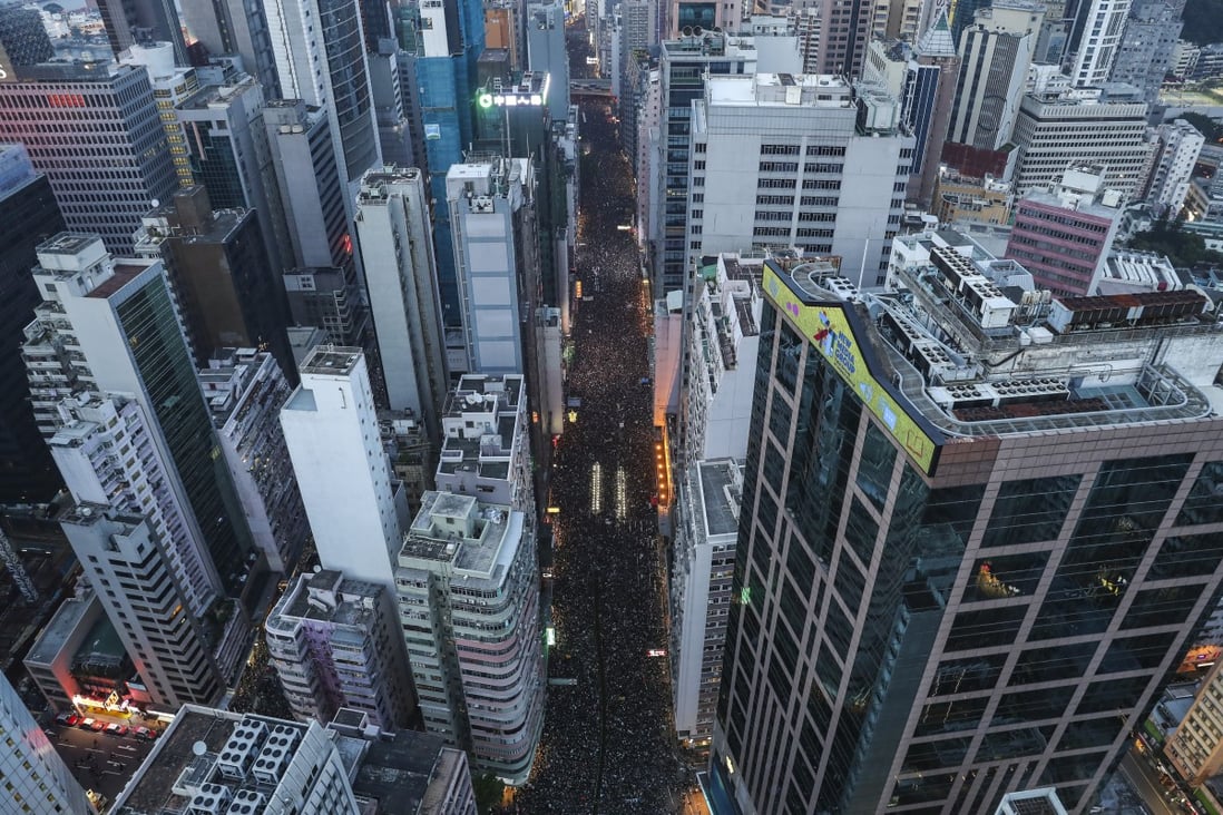 A river of protesters cuts through Hong Kong’s cityscape on June 16, as an estimated two million people march from Causeway Bay to the government offices in Tamar against the proposal to amend the extradition law. Photo: Robert Ng