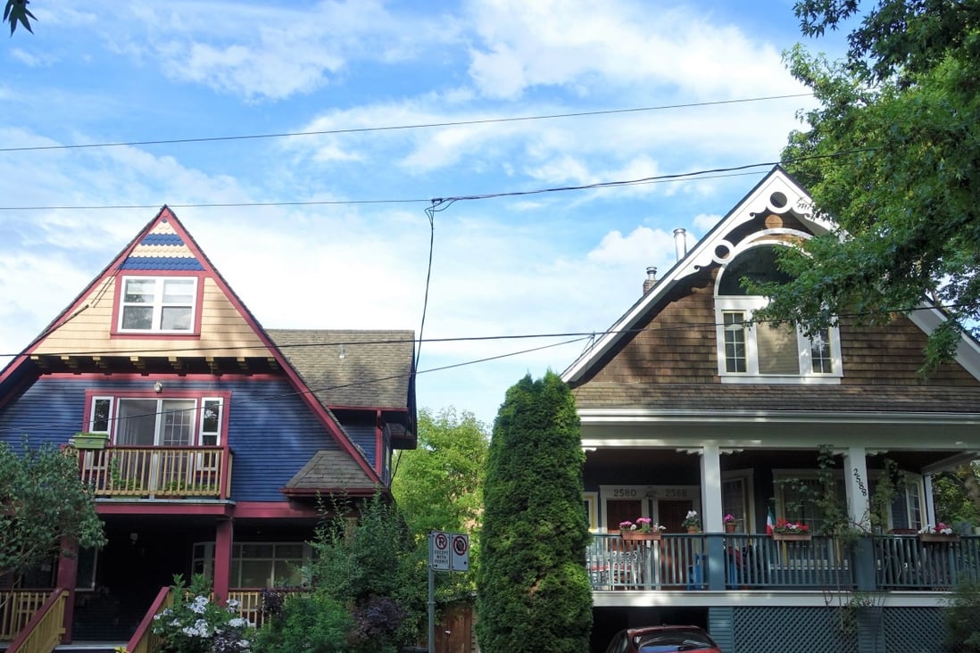 Colourful houses line a street in the Vancouver neighbourhood of Mount Pleasant. Photo: Ian Young