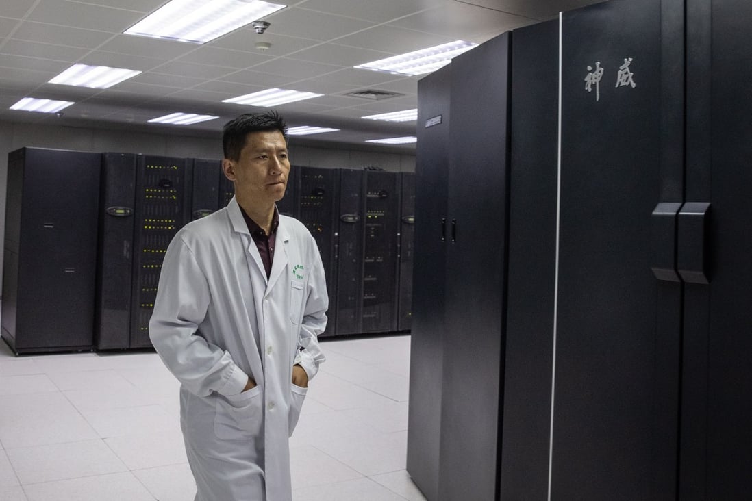 An employee walks next to a row of high-performance computing systems installed at the National Supercomputer Centre in Jinan, capital of the eastern coastal province of Shandong. Photo: EPA-EFE