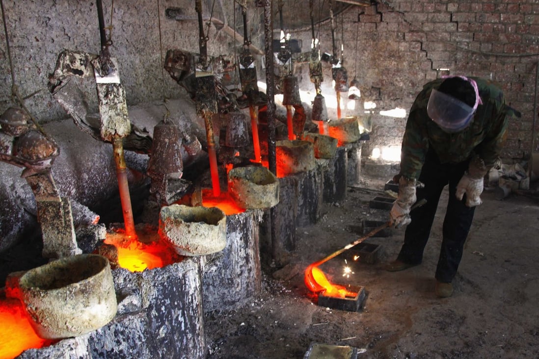 The rare earth metal lanthanum is poured into a mould in China's Inner Mongolia autonomous region. The country supplies more than 70 per cent of the world’s rare earth oxides. Photo: Reuters