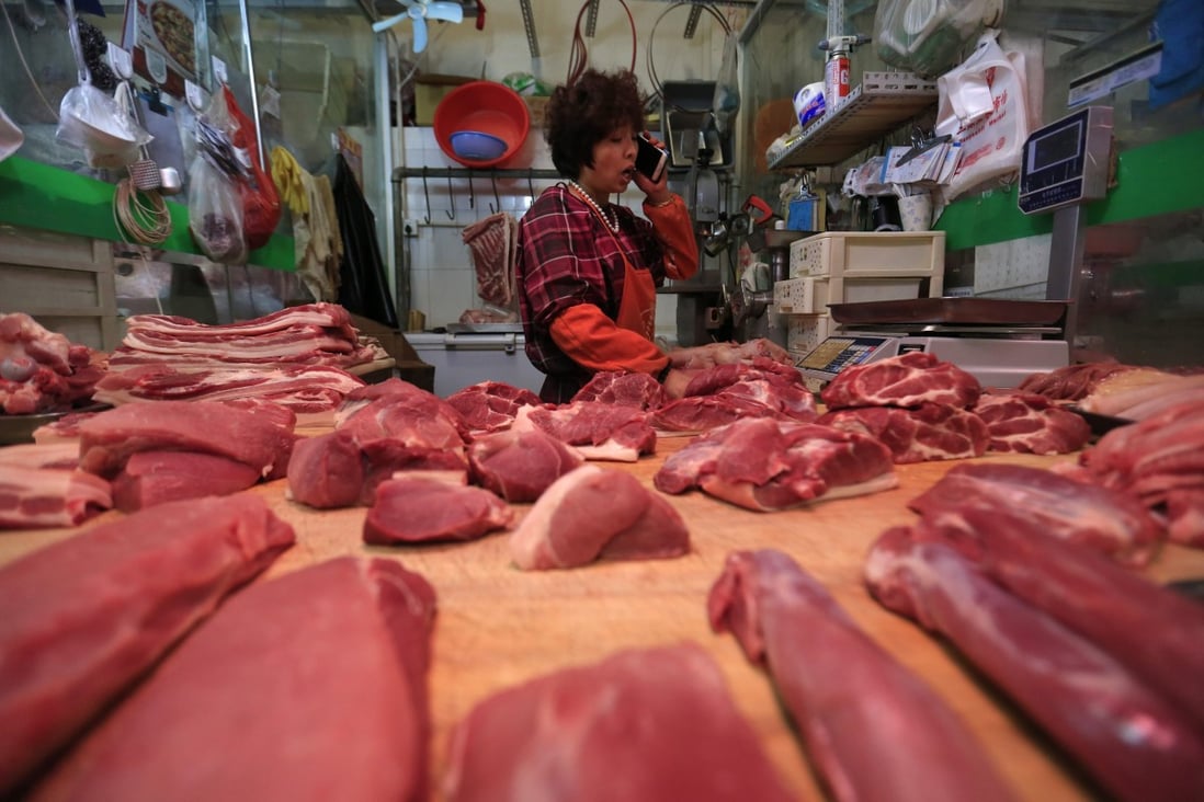 A meat stall in Beijing. Inflation in the price of everyday goods has not taken off, despite a decade of easy money. But this is no cause for celebration. Photo: EPA
