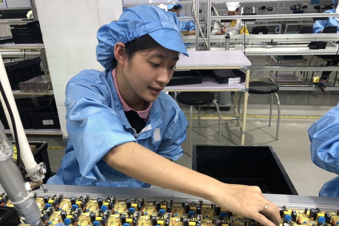 A worker in the adapter production line in a plant inside Vietnam-China Economic and Trade Cooperation Park. Photo: Cissy Zhou