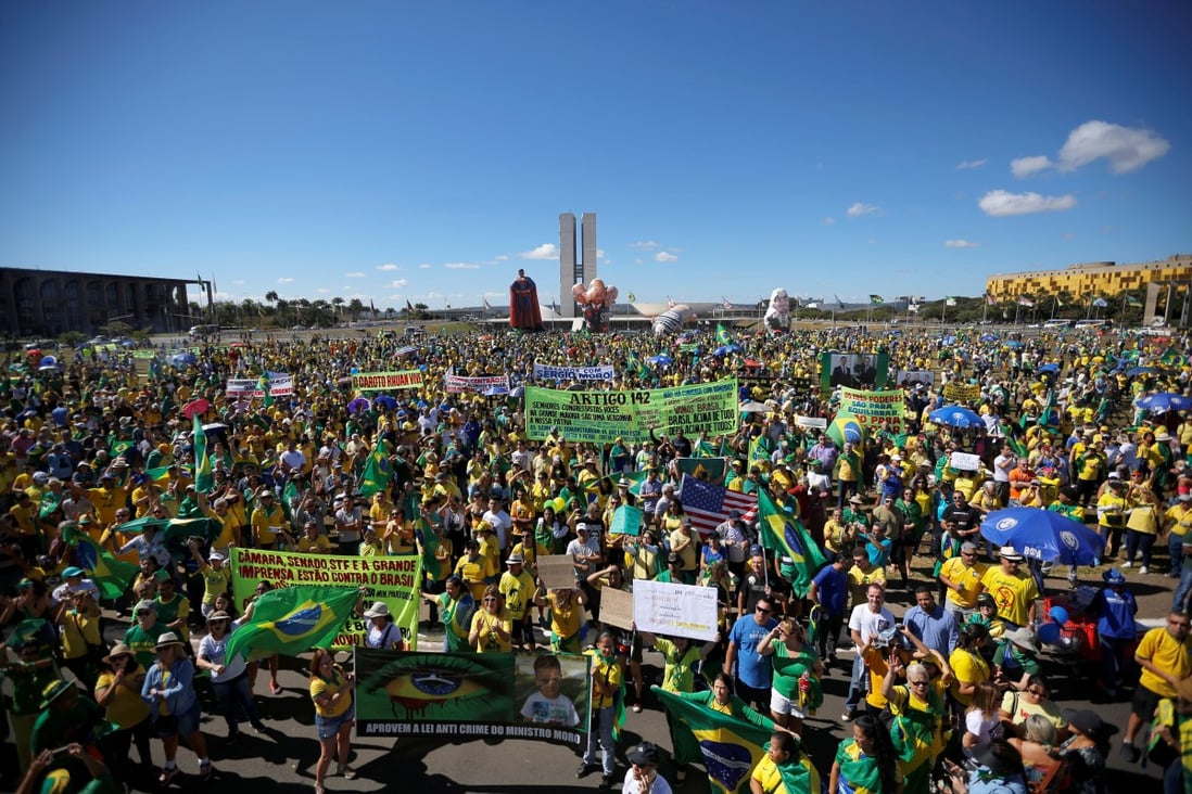 Demonstrators attend a protest against corruption in Brasilia. Photo: Reuters