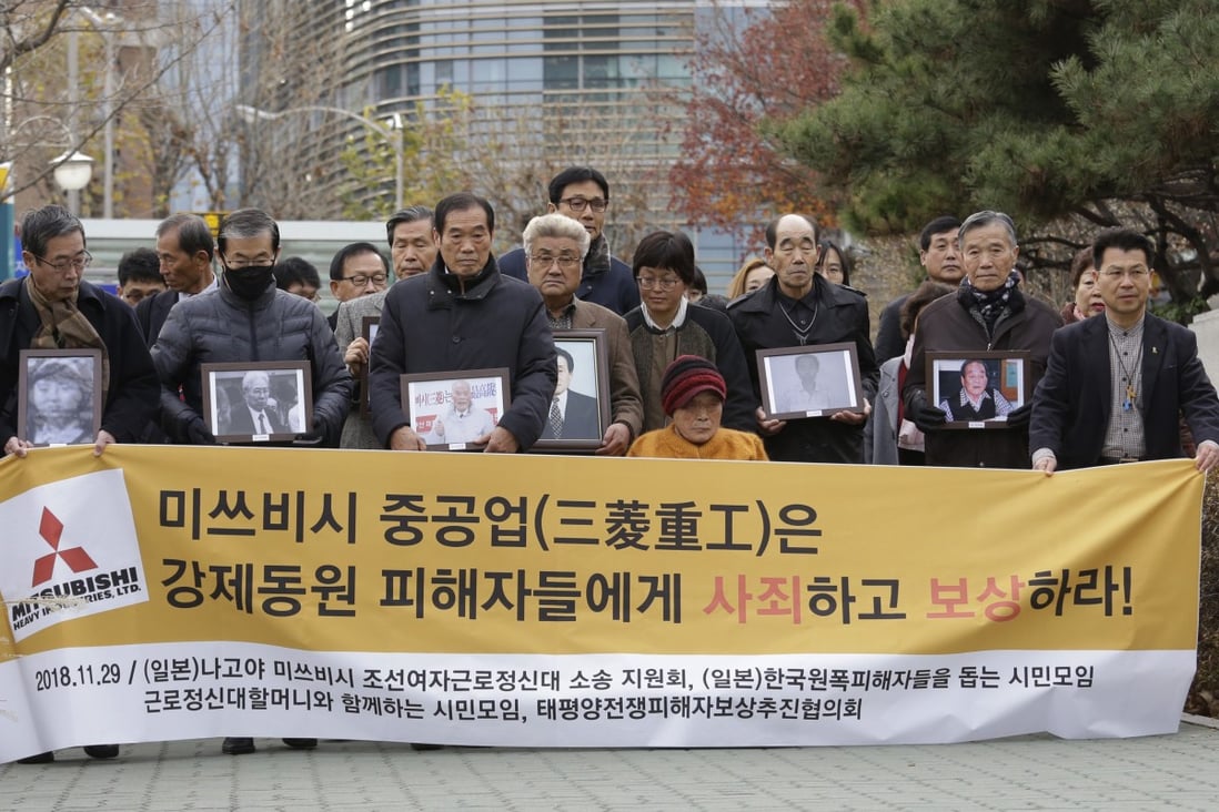 Victims of Japan’s forced labour and their family members at the Supreme Court in Seoul. Photo: AP