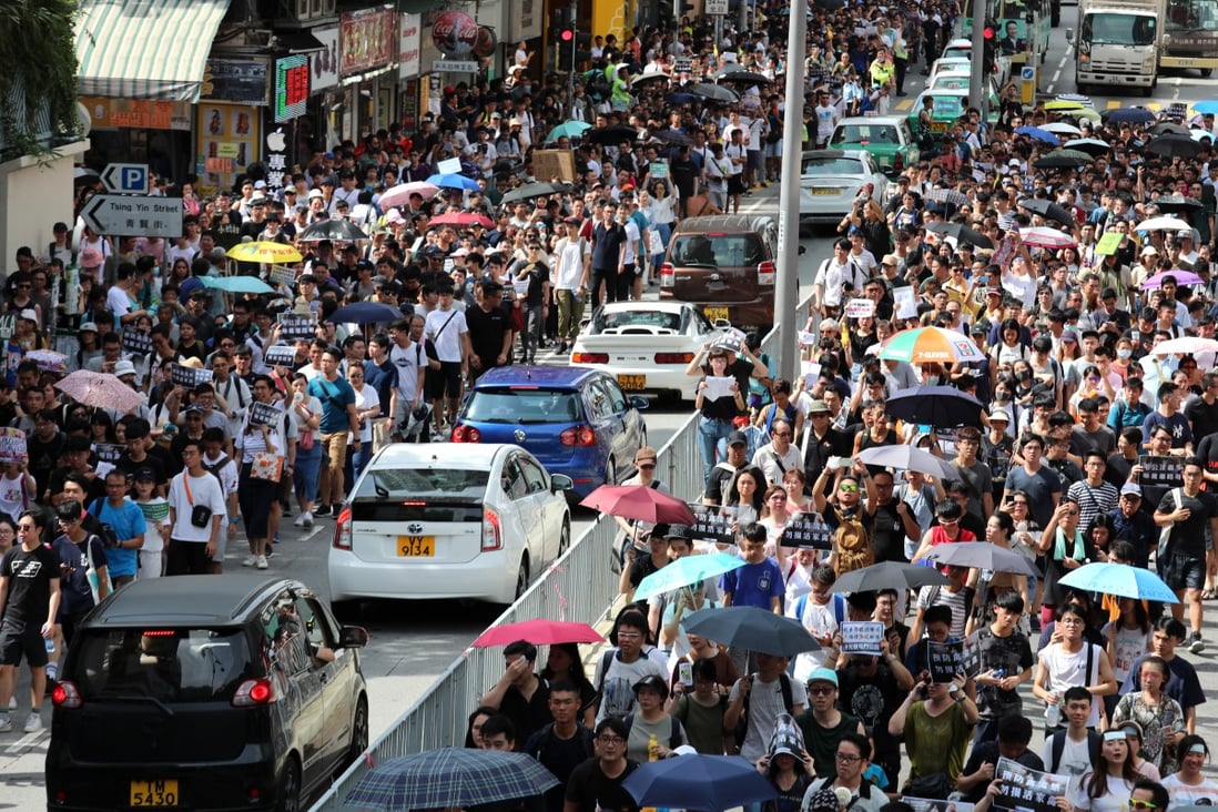 A crowd of nearly 2,000 took to the streets. Photo: Felix Wong