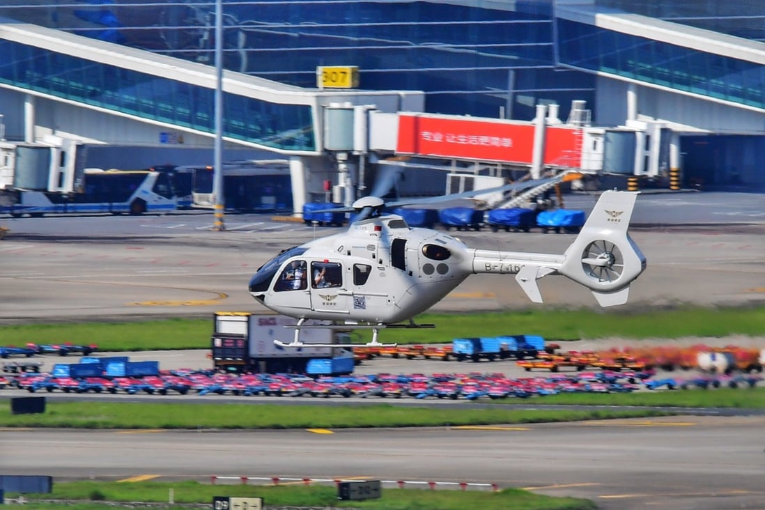 A helicopter departing on the first cross-border flight takes off for Hong Kong at Baoan International Airport in Shenzhen. Photo: Xinhua