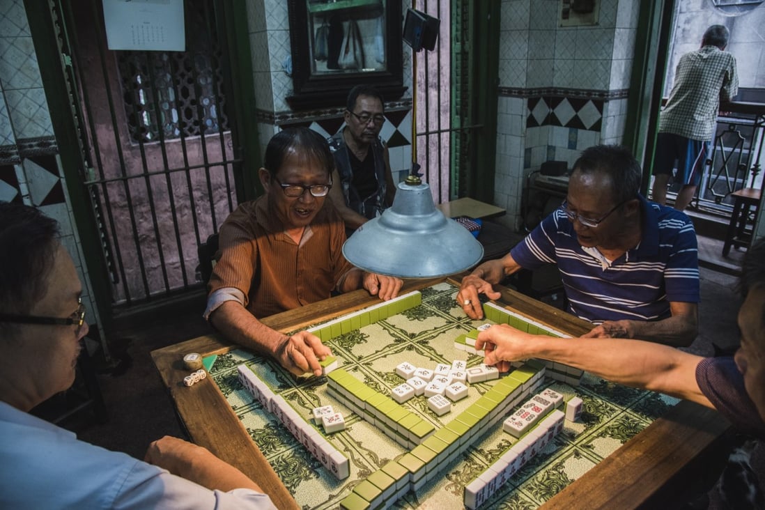 Mahjong players enjoy a game at a club in Tiretta Bazaar, one of two Chinatowns in Kolkata, India. Photo: Jennifer Kishan