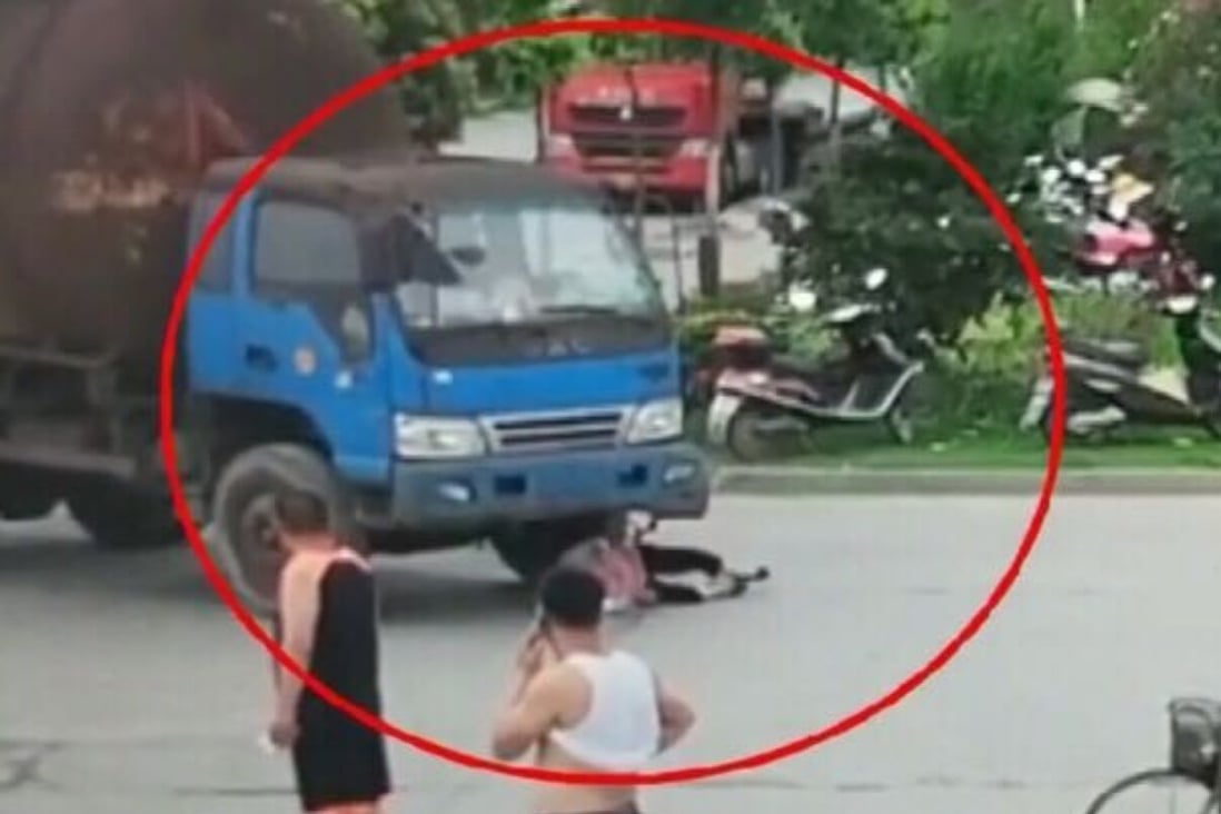 The woman’s efforts to fake a road accident were caught on camera. Photo: AP