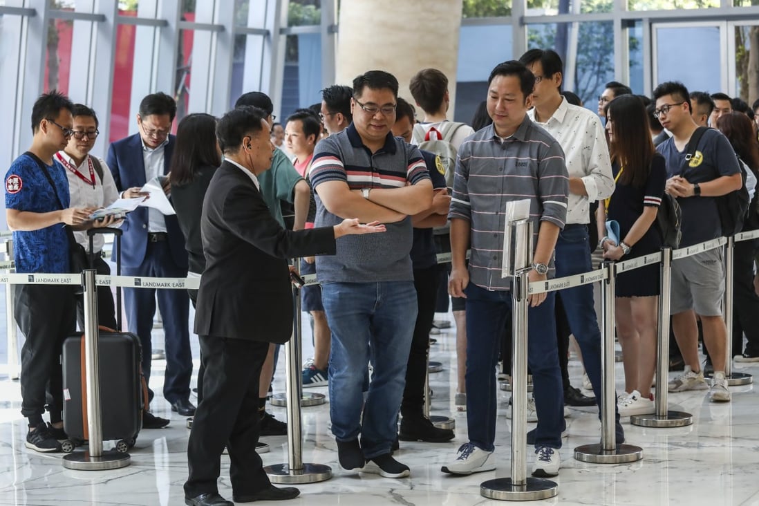 Prospective buyers wait for their turn to buy one of 229 units at Wing Tai Properties’ Oma Pma development in Tuen Mun, on June 30, 2019. The developer is putting on sale another lot of flats at the same project on Saturday. Photo: Jonathan Wong