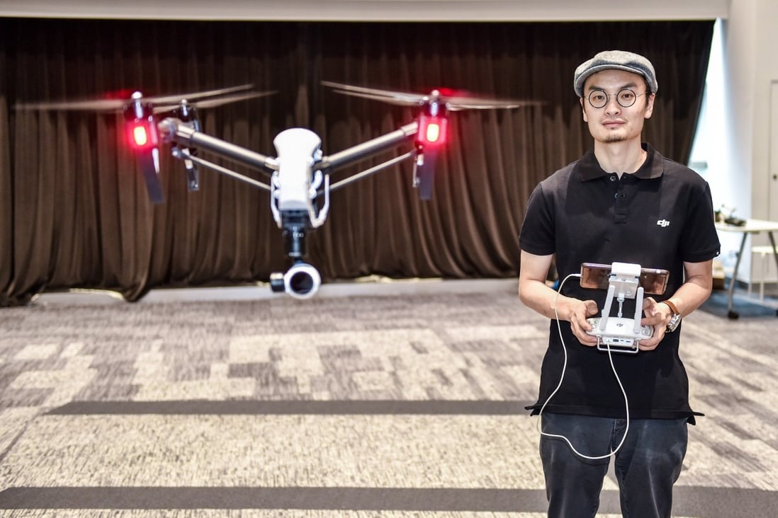 Wang Tao, founder of DJI, controls a drone in his company’s Shenzhen headquarters. Photo: Xinhua