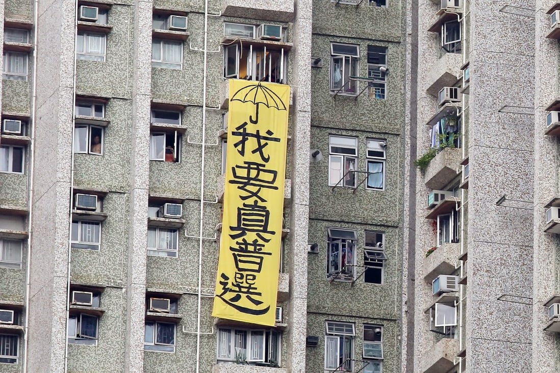 A protest banner hangs from the window of a flat in 2016, saying “I want real elections”, complete with a yellow umbrella, the symbol of the 2014 Occupy movement, then Hong Kong’s largest pro-democracy demonstration. Photo: Nora Tam