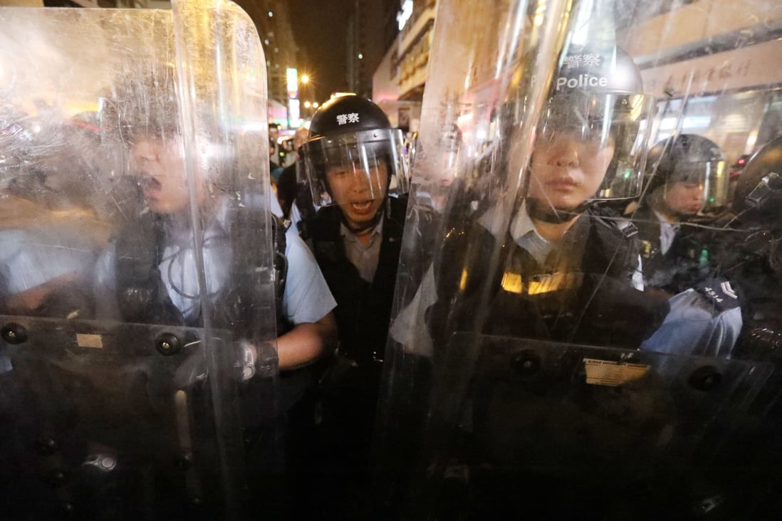 Riot police push forward at an extradition bill protest in Mong Kok on July 7. Photo: Felix Wong