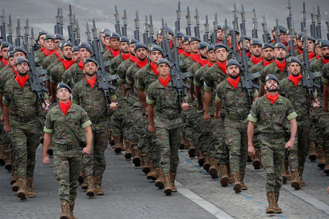 Spanish soldiers march during the traditional Bastille Day military parade on the Champs-Elysees Avenue in Paris. Photo: Reuters