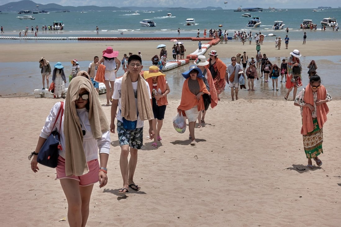 Chinese tourists return from a boat trip in Thailand’s Pattaya. Photo: Alamy