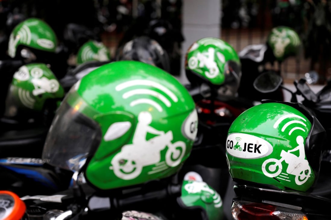 FILE PHOTO: Gojek driver helmets are seen during Go-Food festival in Jakarta, Indonesia, October 27, 2018. REUTERS/Beawiharta/File Photo