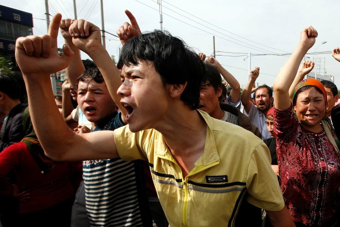 A crowd yells at Chinese police during a confrontation in Urumqi, Xinjiang, in 2009. China had declared itself a “victim of international terrorism” eight years earlier, helping “establish the narrative of a Uygur terrorist threat” in Xinjiang, writes Nick Holdstock in China’s Forgotten People: Xinjiang, Terror and the Chinese State. Photo: Reuters