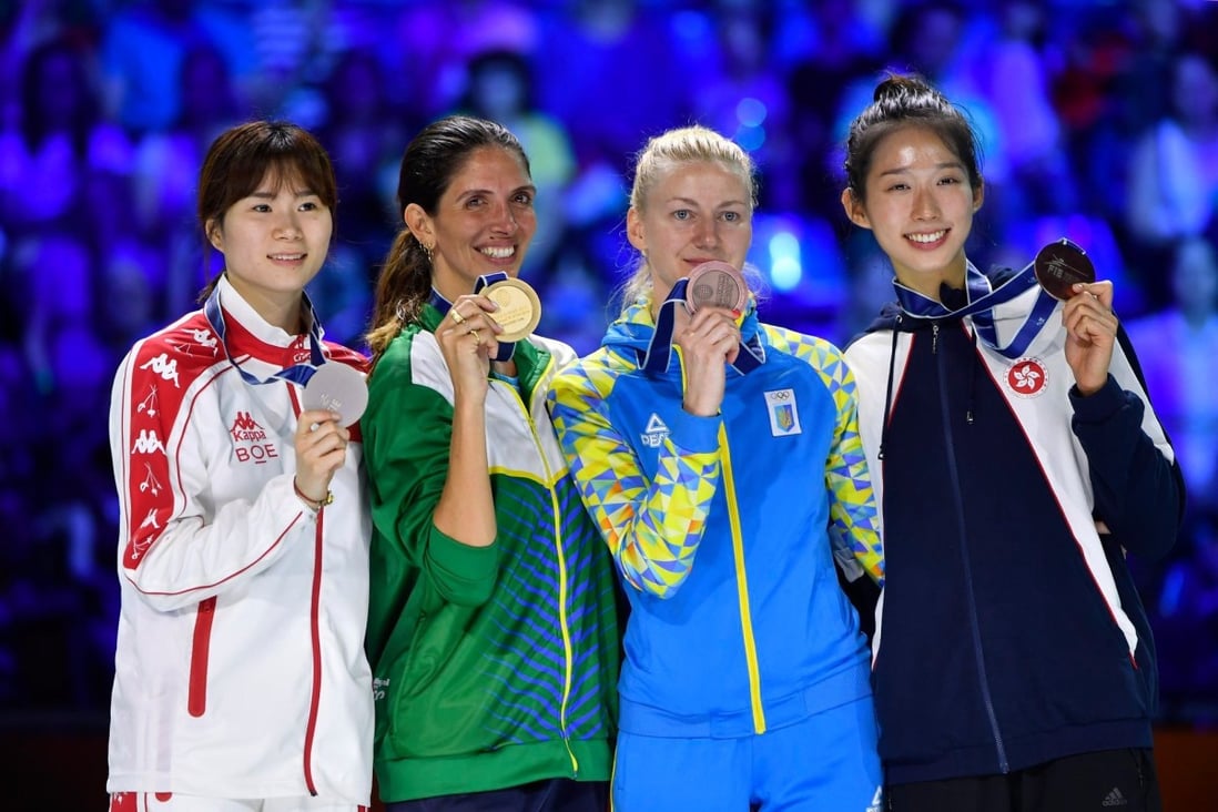 Vivian Kong (right) shows off her bronze medal with the other medal winners at the world championships in Budapest. Photo: FIE/Facebook